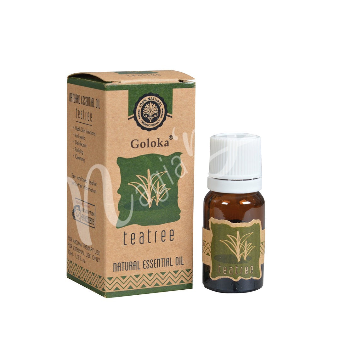 A bottle of Goloka Tea Tree Natural Essential Oil alongside its packaging box.
The packaging has a natural, earthy design with green and brown tones, emphasizing its organic and natural qualities.