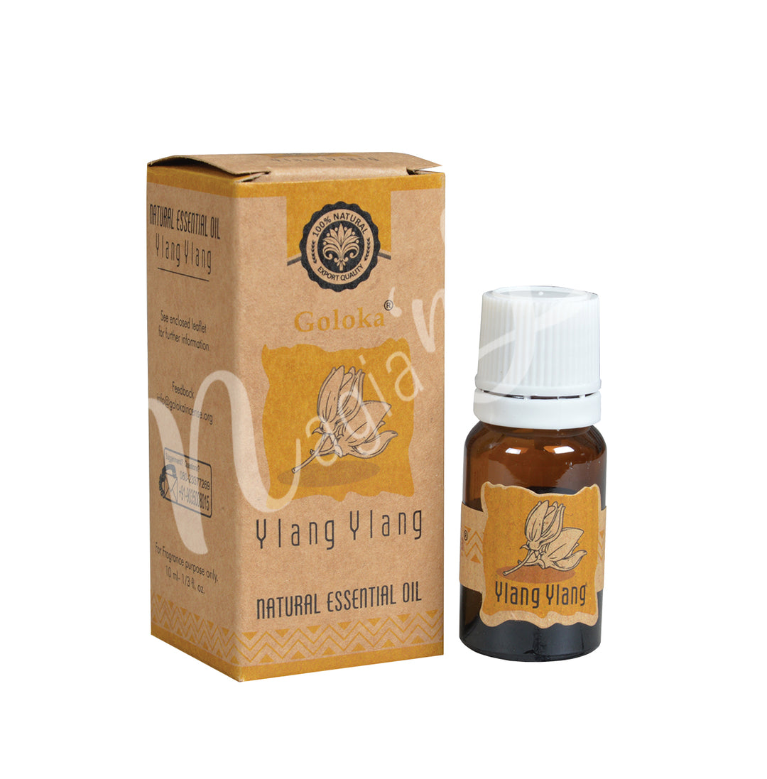 A bottle of Goloka Ylang Ylang Natural Essential Oil alongside its packaging box.
The packaging has an ylang ylang flower, earthy design with yellow and brown tones, emphasizing its organic and natural qualities.