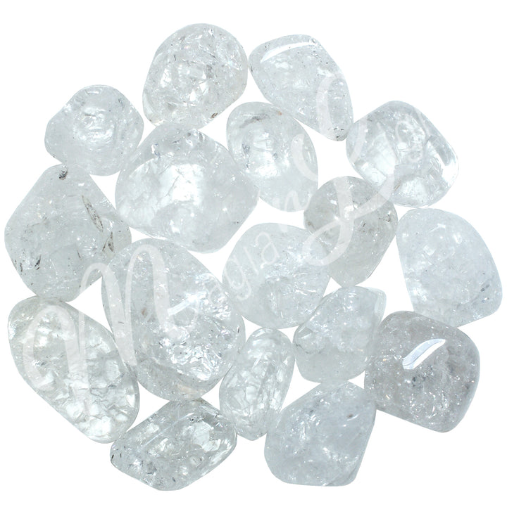 Collection of polished tumbled stones in shades of gray, arranged together in a circular pile.
