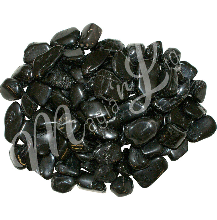 Collection of polished black tumbled stones, arranged together in a circular pile.