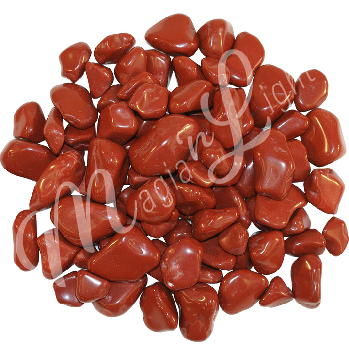 Collection of polished tumbled stones in shades of red, arranged together in a circular pile.