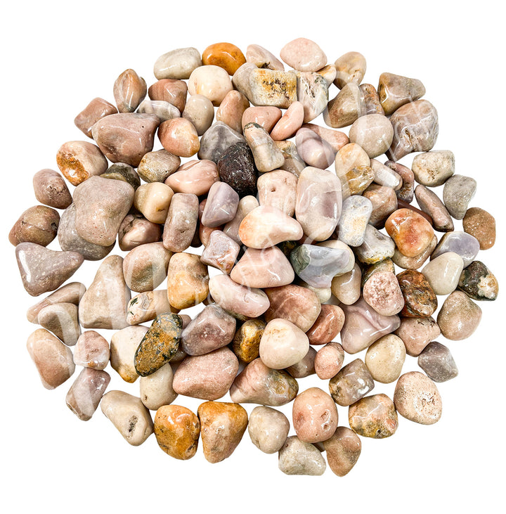 Collection of polished tumbled stones in shades of pink, orange, brown, and cream, arranged together in a circular pile.