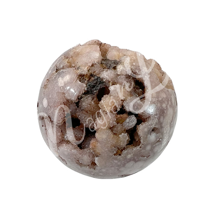 A sphere made of pink amethyst, with a sparkling druzy crystal center, seen with a different color shade.