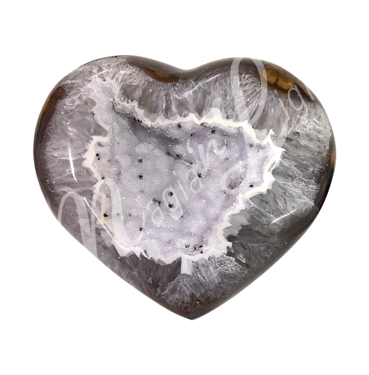 Heart-shaped grey agate with a sparkling druzy crystal center and fragmented pattern along the edges.