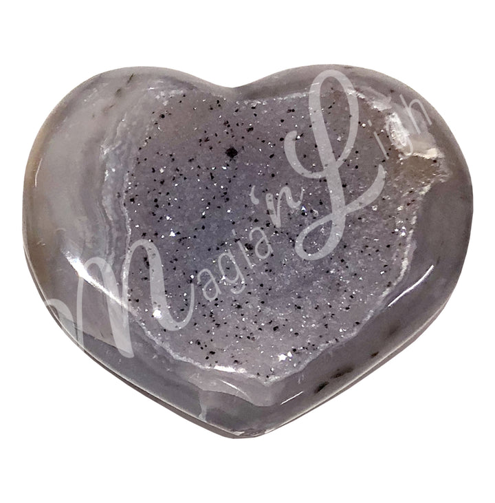 Heart-shaped grey agate with a sparkling druzy crystal center and smooth edges.