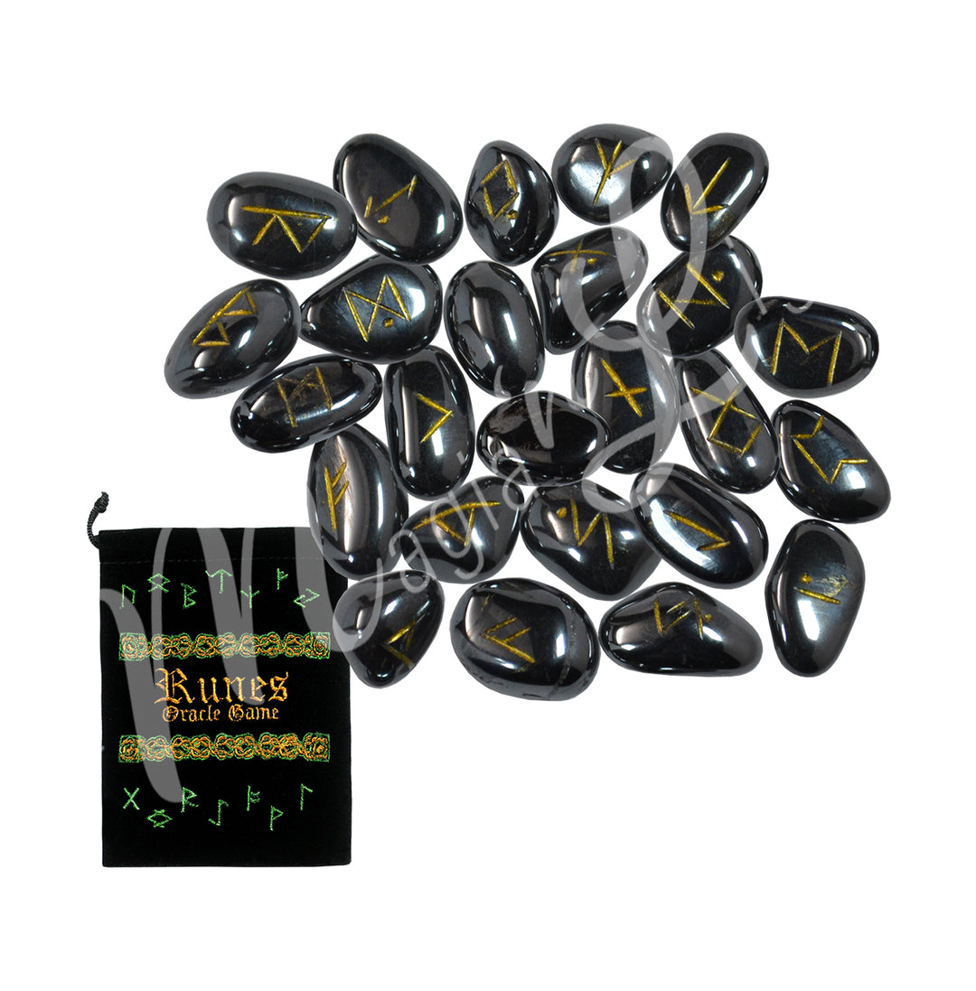A set of hematite runestones with engraved and painted gold symbols, displayed with a black velvet pouch. The pouch is embroidered with the words "runes oracle game", as well as runic symbols.
