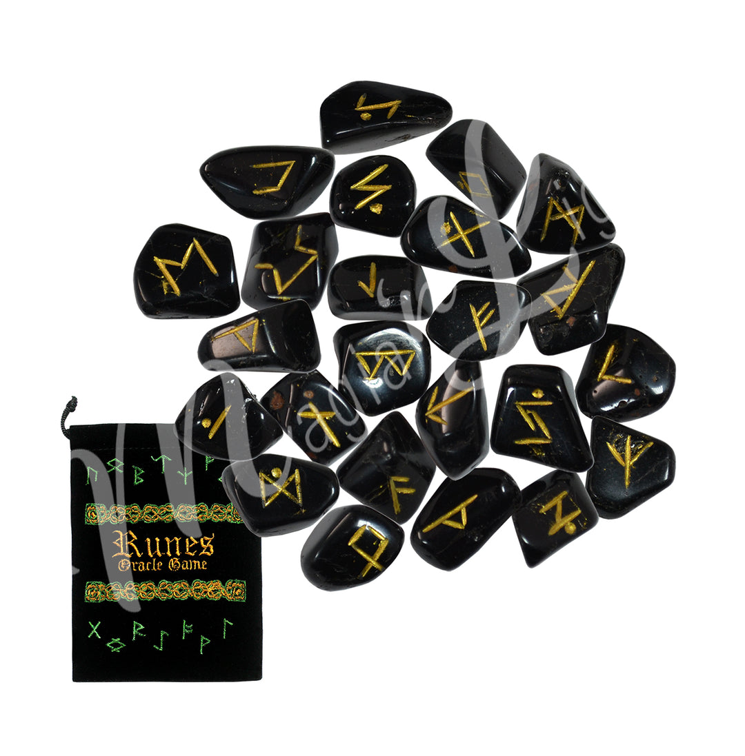 A set of black tourmaline runestones with engraved and painted gold symbols, displayed with a black velvet pouch. The pouch is embroidered with the words "runes oracle game", as well as runic symbols.