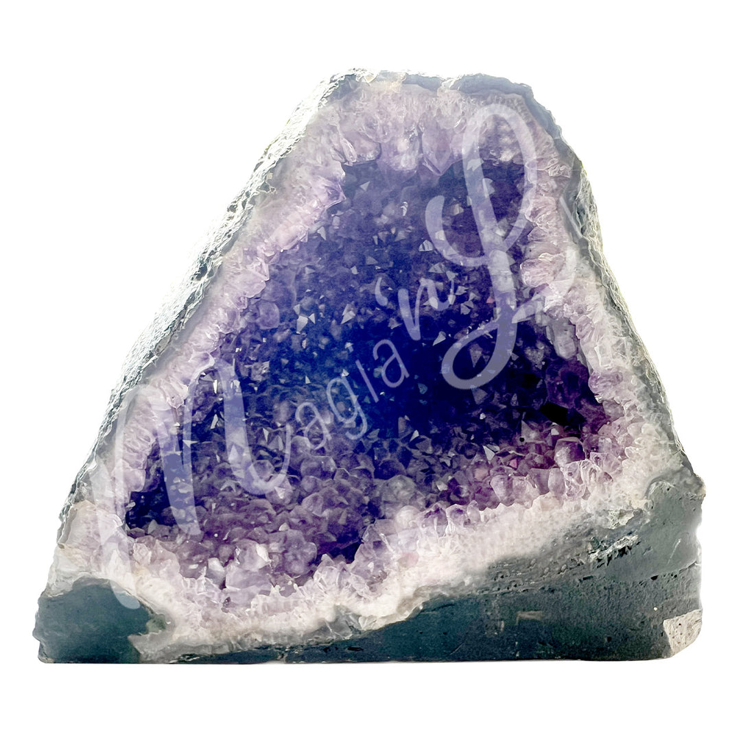 Front view of an amethyst cathedral. The center is purple with glitter while the sides go from white to gray on the exterior.