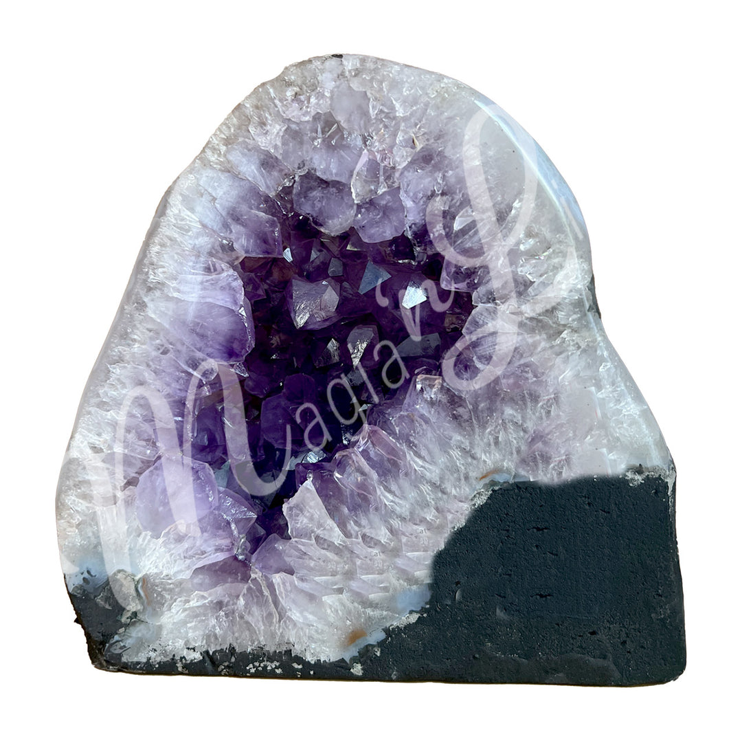 Front view of an amethyst cathedral. The center is purple with glitter while the sides go from white to gray on the exterior.