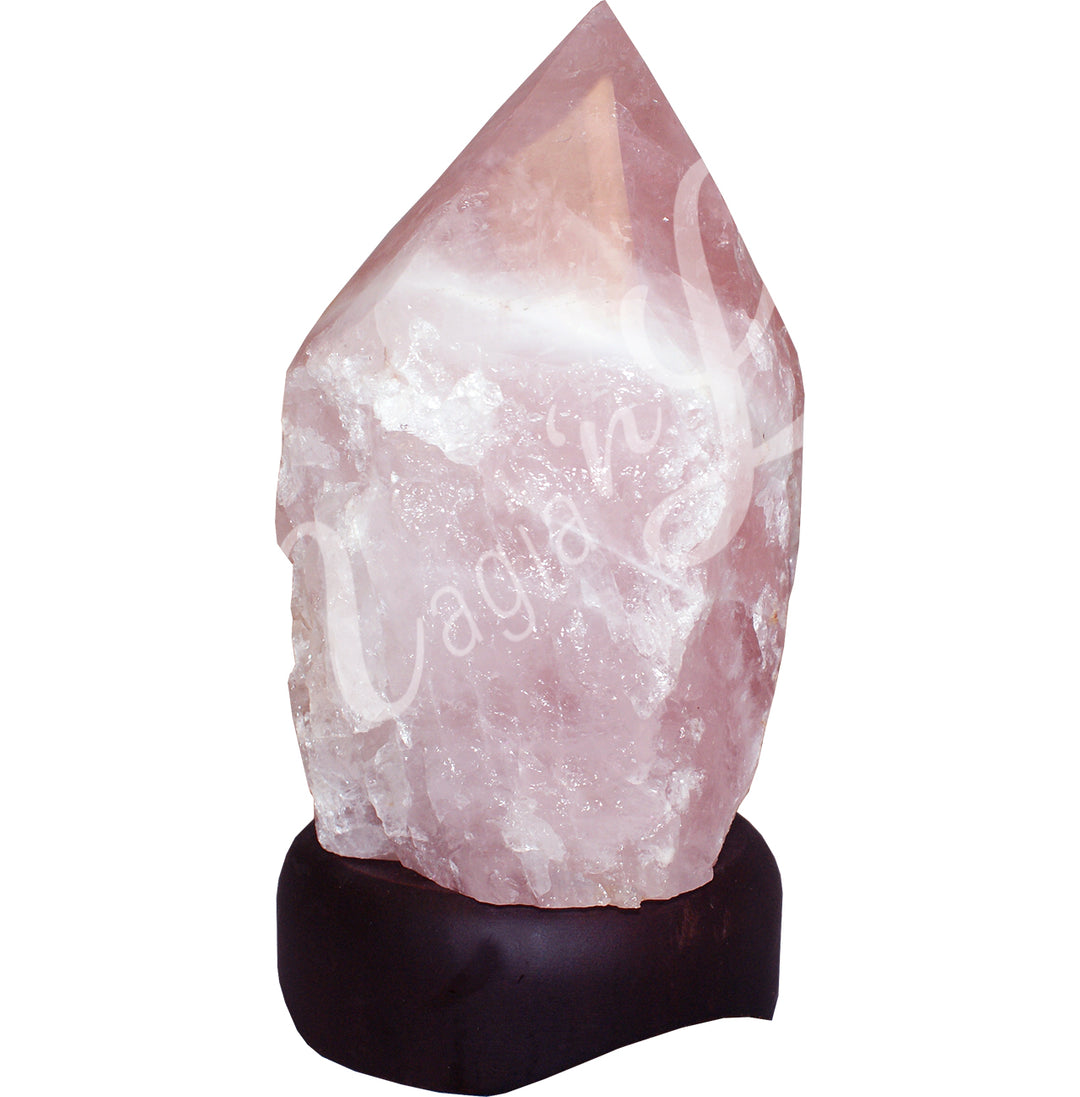 Top polished point rose quartz crystal lamp mounted on a dark wooden base.
