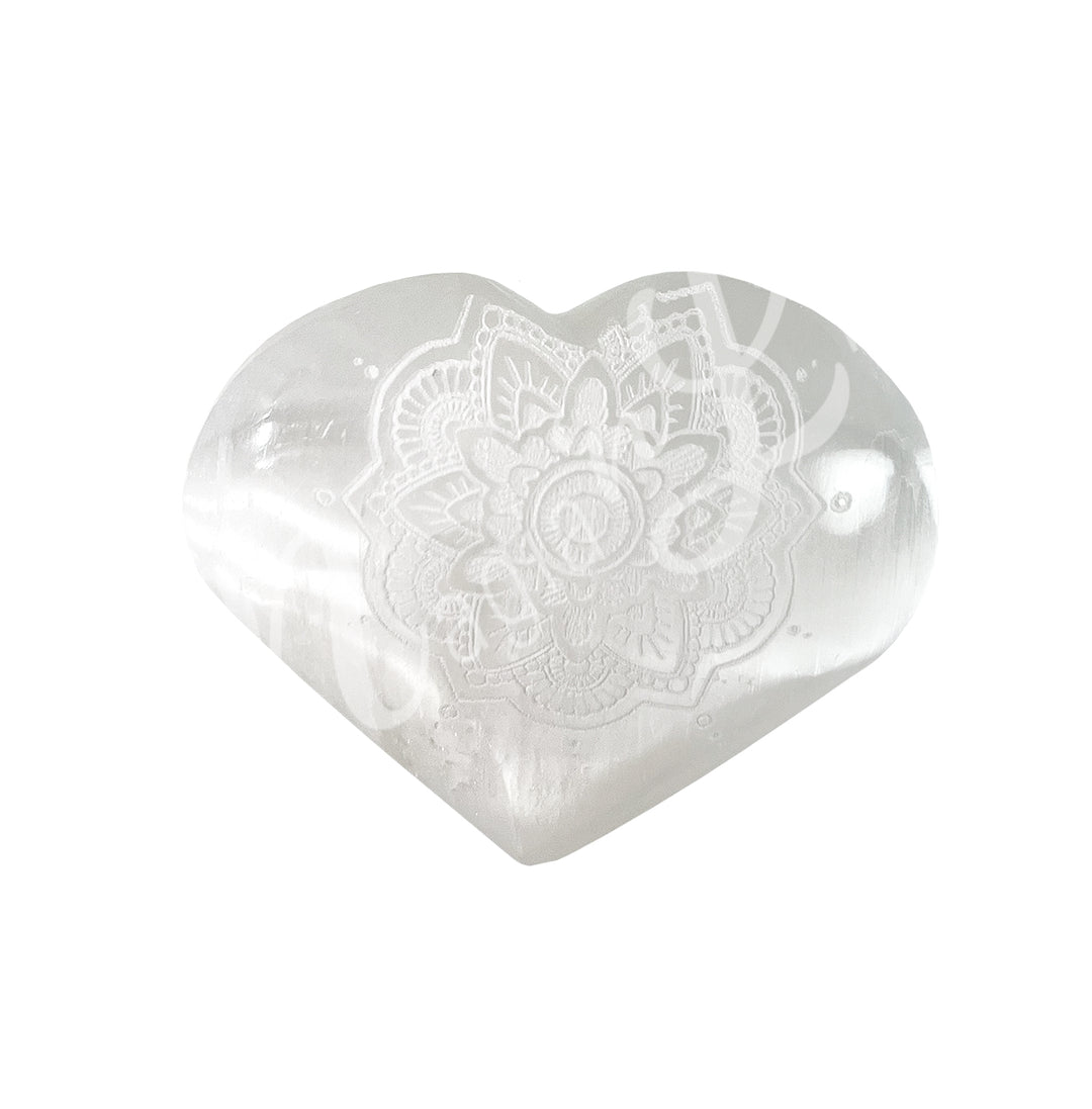 An heart-shaped Selenite crystal engraved with the lotus mandala symbol.