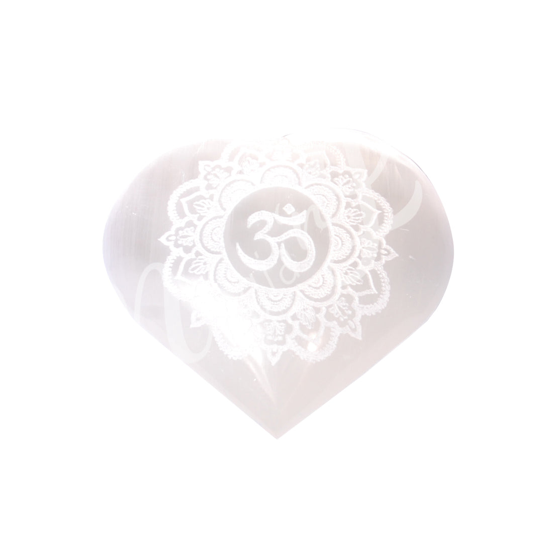An heart-shaped Selenite crystal engraved with the OM symbol in a lotus flower.
