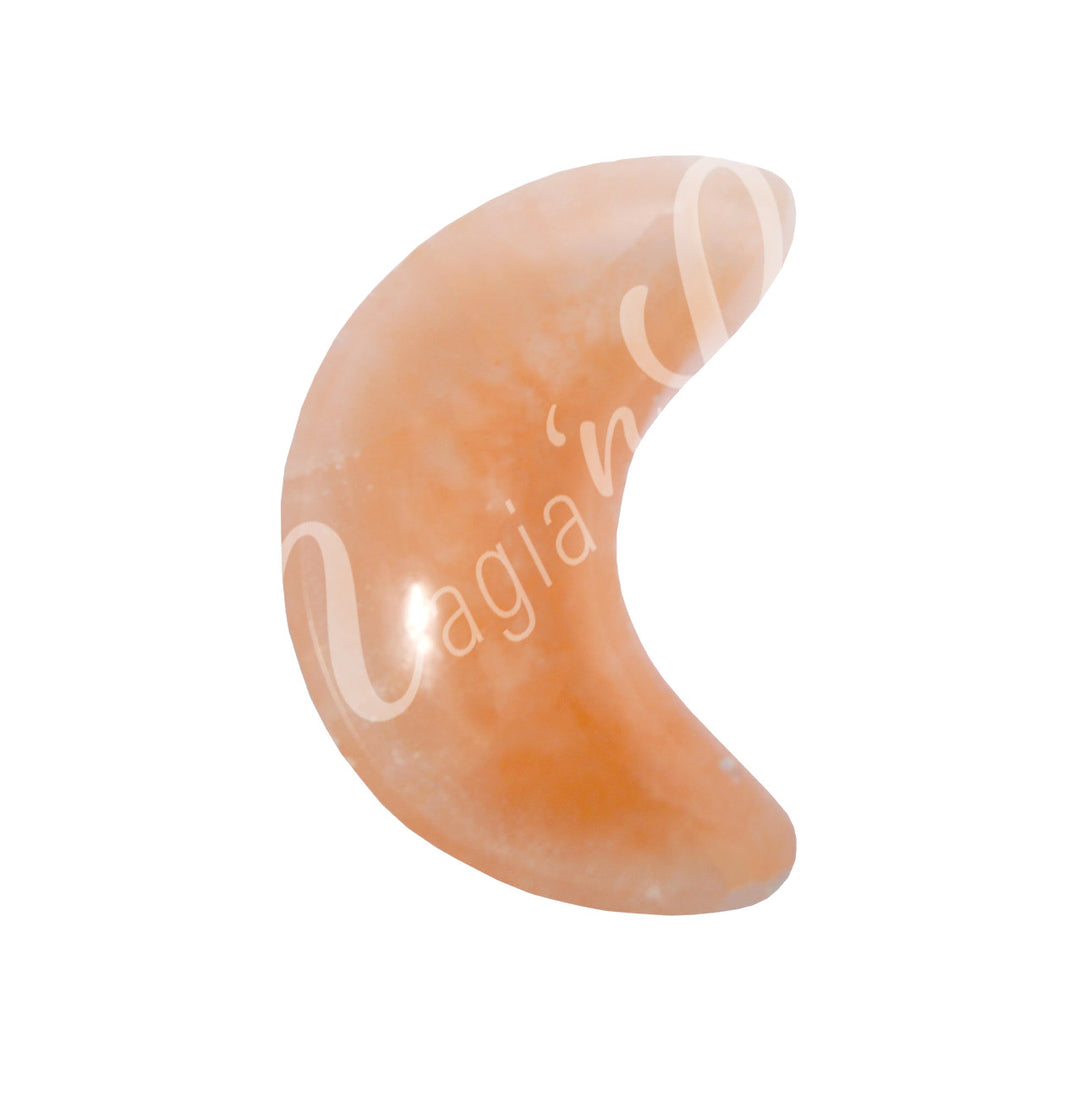 A Polished orange selenite crescent moon-shaped bowl viewed from above, showing its curved form.