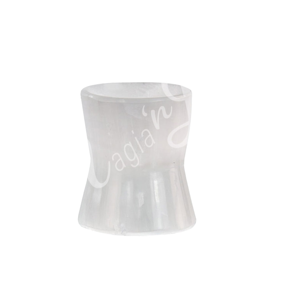 A wide-based selenite stand designed to hold spheres.