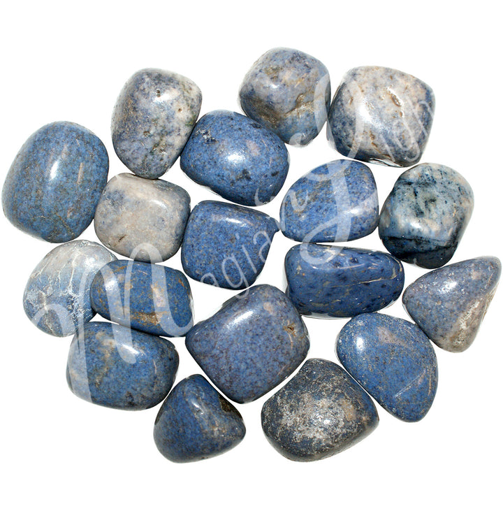 Collection of polished tumbled stones in shades of blue, white, black, and beige, arranged together in a circular pile.
