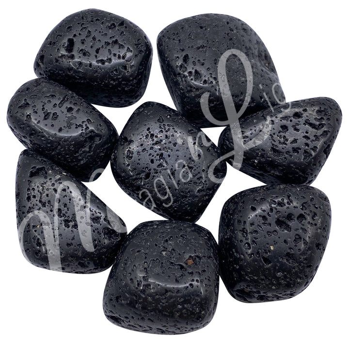 Collection of polished tumbled stones in shades of black, arranged together in a circular pile.