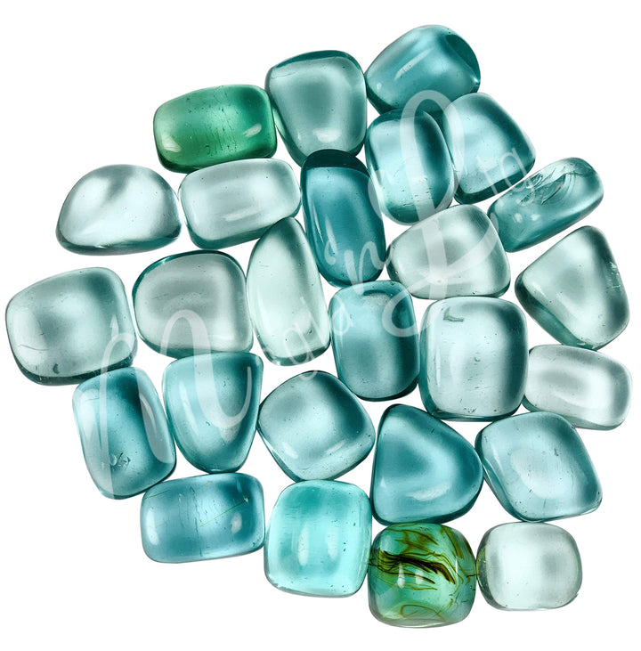 Collection of polished tumbled stones in shades of blue, green, and turquoise, arranged together in a circular pile.