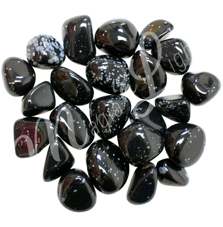Collection of black polished tumbled stones with white and grayish snowflakes, arranged together in a circular pile.