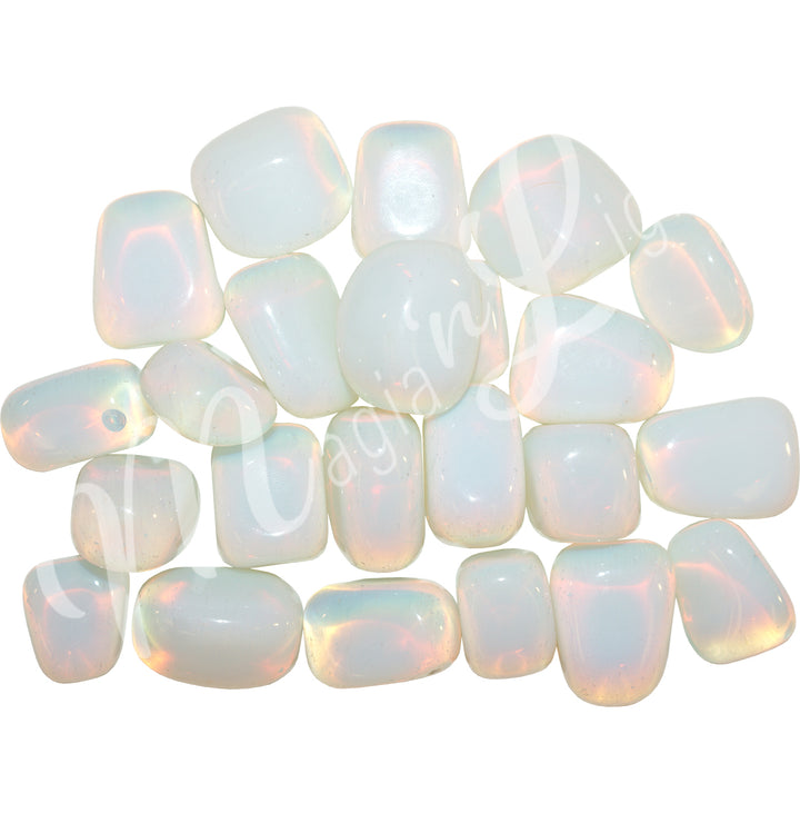 Collection of polished white transparent tumbled stones, arranged together in a rectangular pattern.
