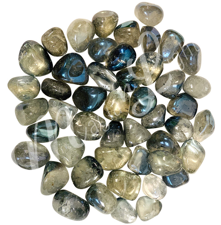 Collection of polished tumbled stones in shades of blue, brown, and gold, arranged together in a circular pile.