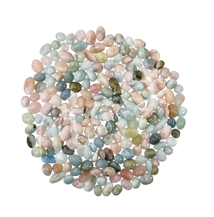 Collection of polished tumbled stones in shades of green, blue, brown, and cream, arranged together in a circular pile.