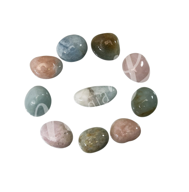 Ten tumbled stones of Morganite arranged in a circular pattern.