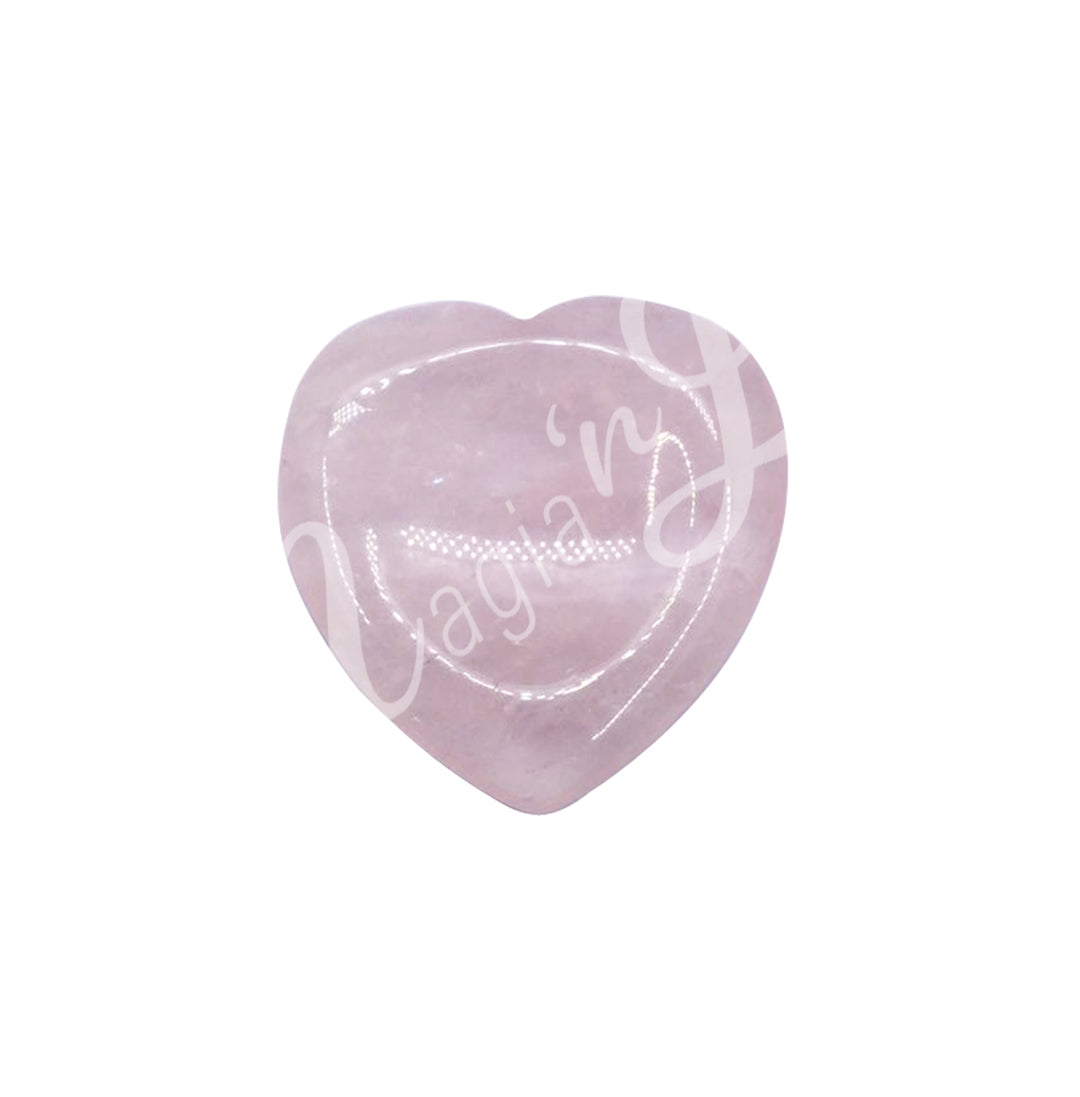 A pink polished heart-shaped stones with a smooth, glossy surface.