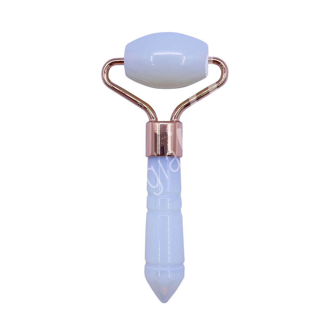 Opalite facial roller with a rose-gold frame and a pointed handle for targeted facial massage.