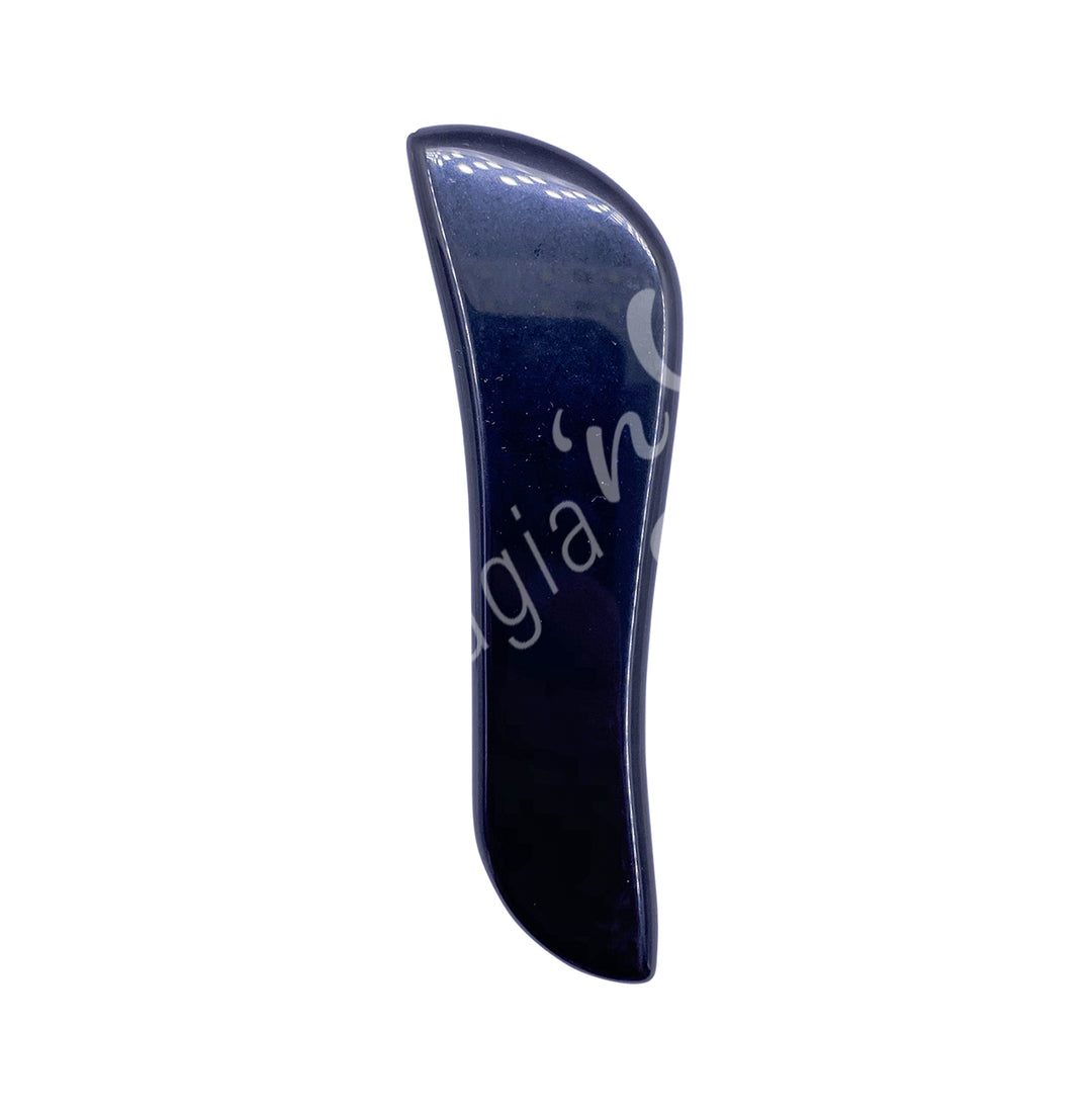 Black obsidian gua sha massage stone with a slim, curved shape and smooth polished surface.