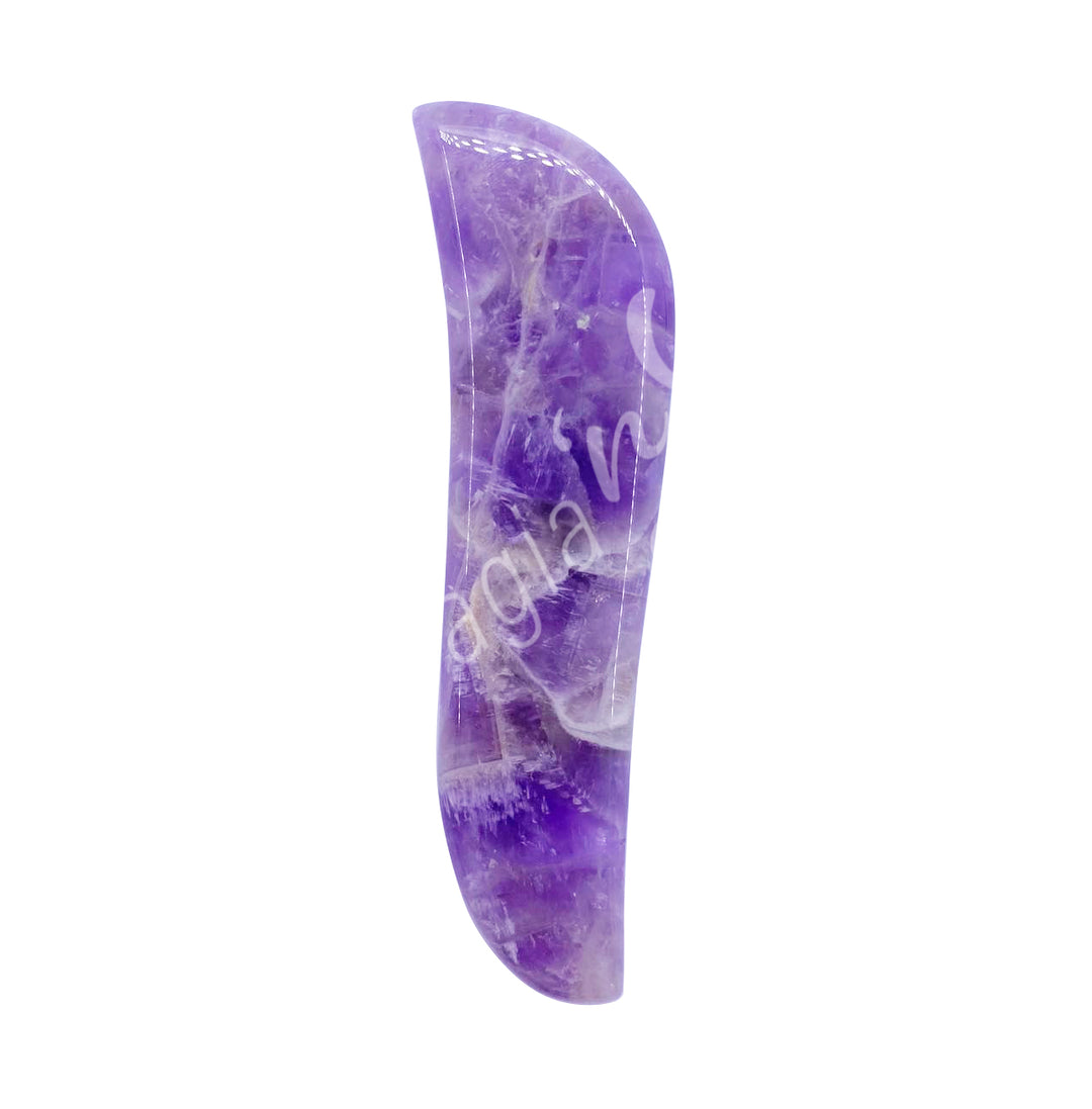 Chevron amethyst gua sha massage stone with a slim, curved shape and smooth polished surface.