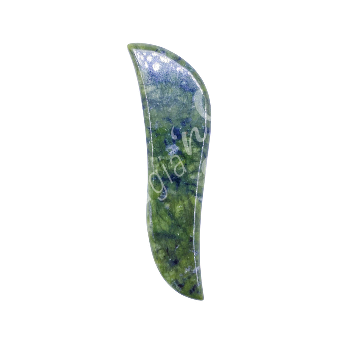 Jade gua sha massage stone with a slim, curved shape and smooth polished surface.