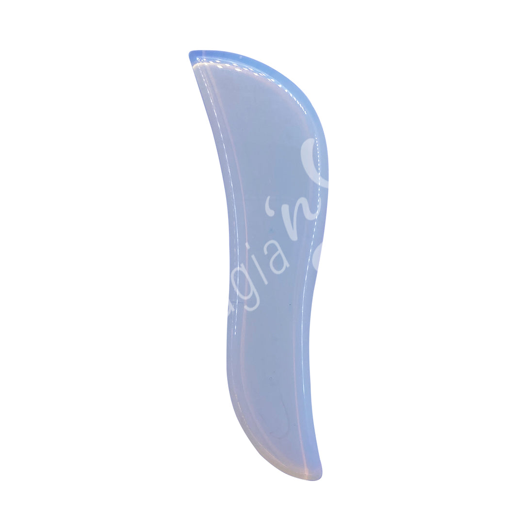 Opalite gua sha massage stone with a slim, curved shape and smooth polished surface.
