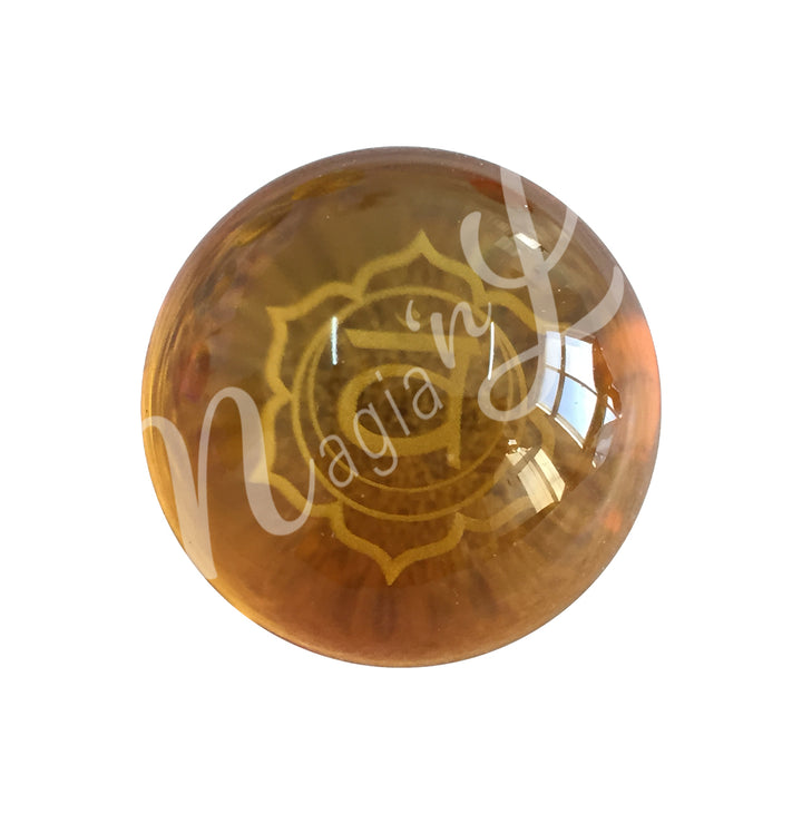 An orange sphere featuring the sacral chakra symbol.