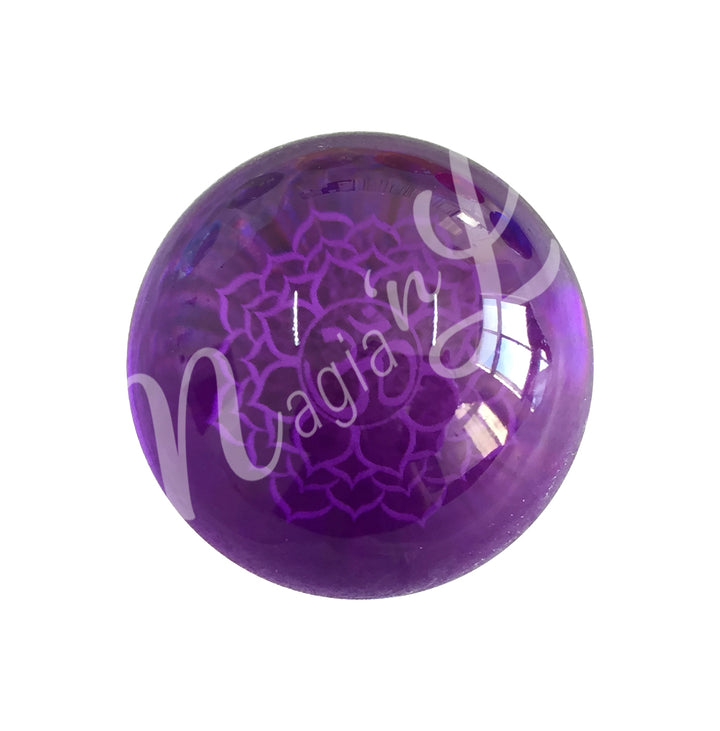 A purple sphere featuring the crown chakra symbol.