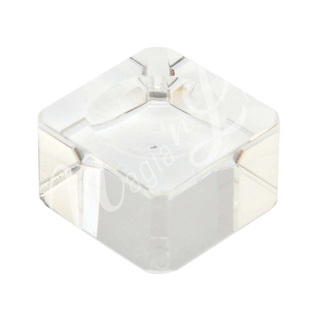 A clear glass cube stand for sphere.