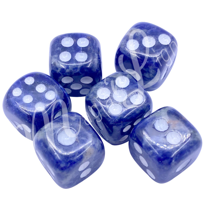 Set of six polished sodalite gemstone dice with white engraved dots.