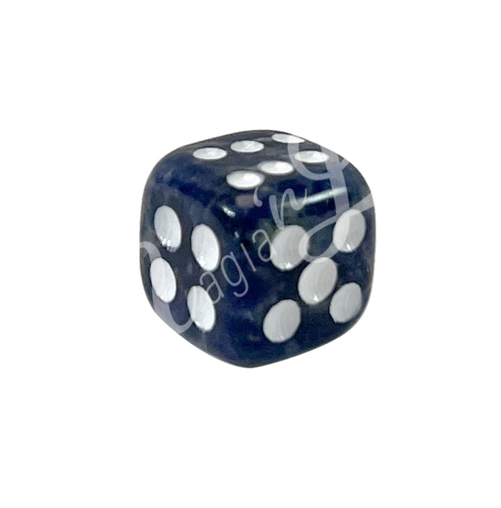 A polished Sodalite gemstone dice with white engraved dots.