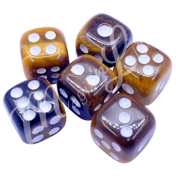 Set of six polished Tiger Eye gemstone dice with white engraved dots.