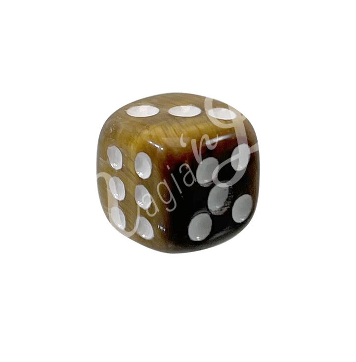 A polished Tiger Eye gemstone dice with white engraved dots.