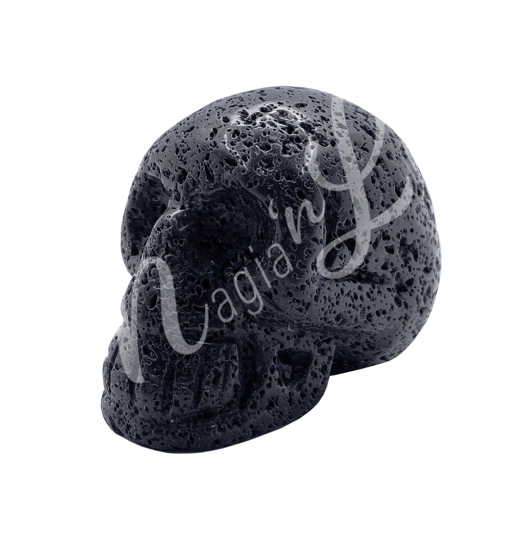 A polished lava stone skull carving with a porous surface, reminiscent of a meteorite.