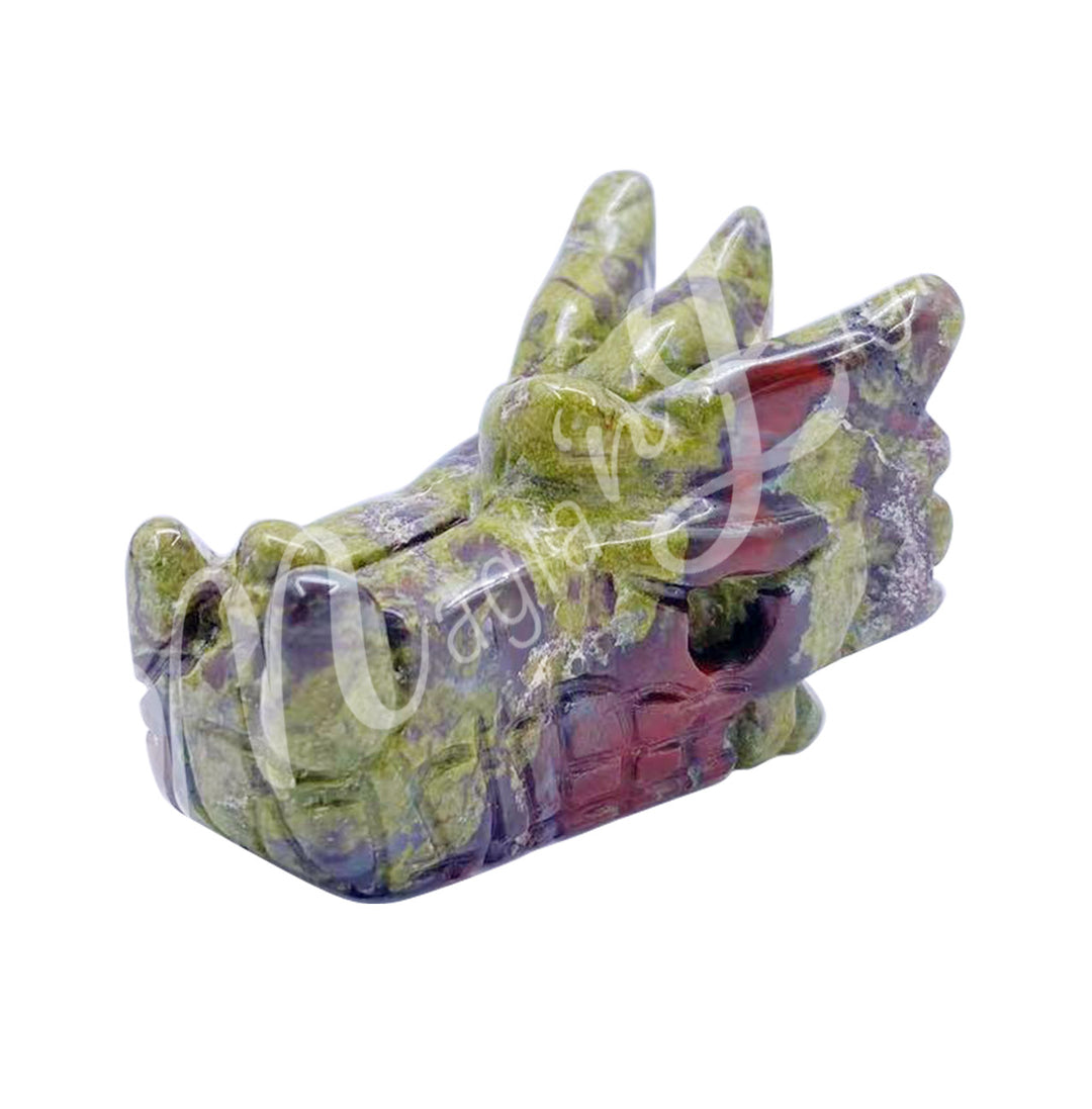 A carving of a dragon's head made of dragonblood jasper.