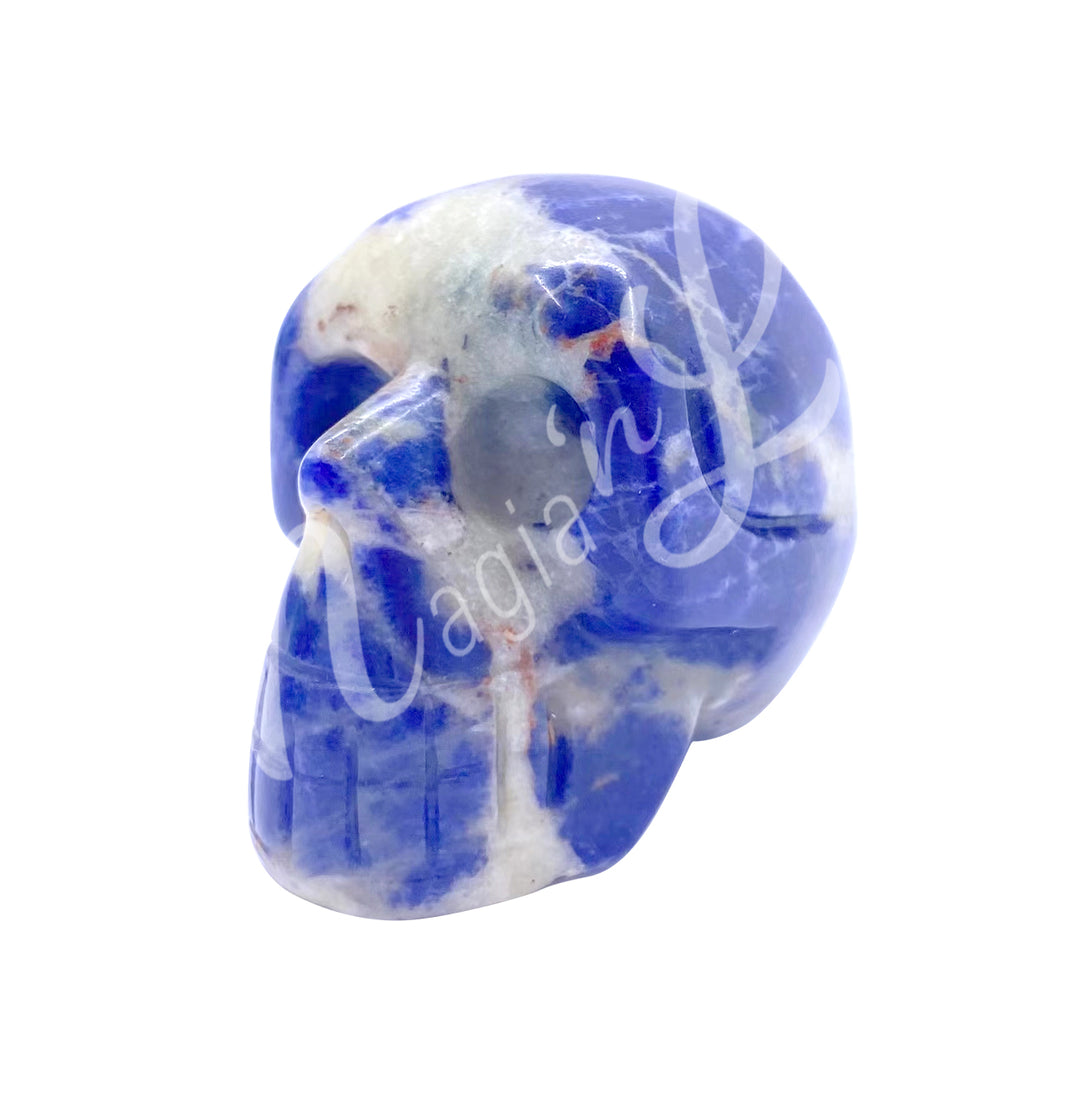 A polished skull carving made of sodalite.