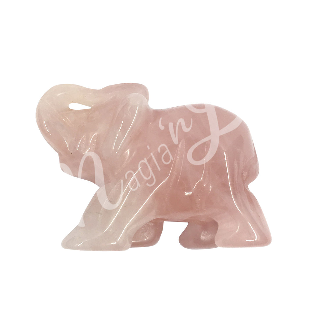 A carving of an elephant made of rose quartz.