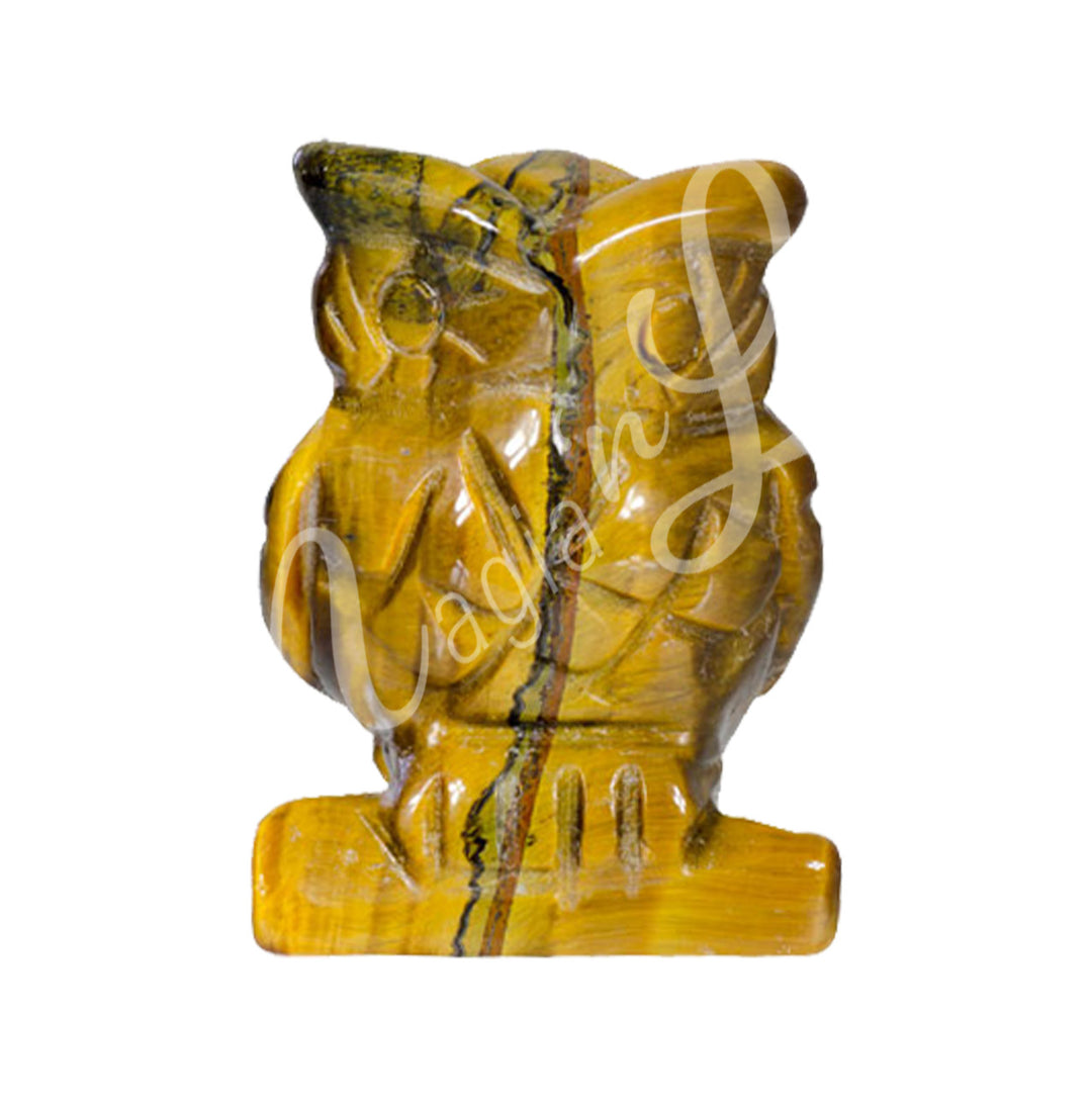 A carving of an owl made of tiger eye.