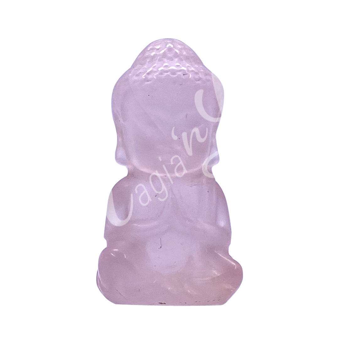 A carving of a Buddha made of Rose Quartz.