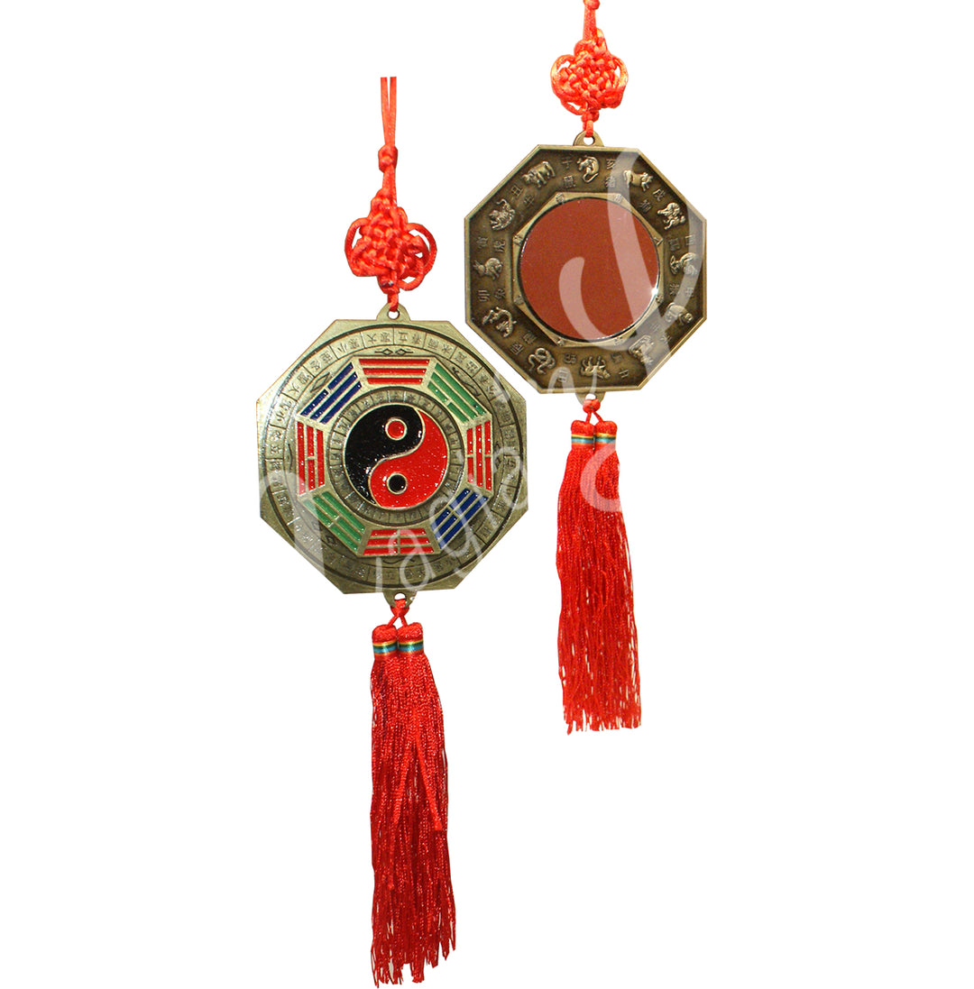 Feng Shui Bagua mirror charm with a red tassel, featuring a yin-yang symbol on one side and a reflective mirror with zodiac signs on the other.