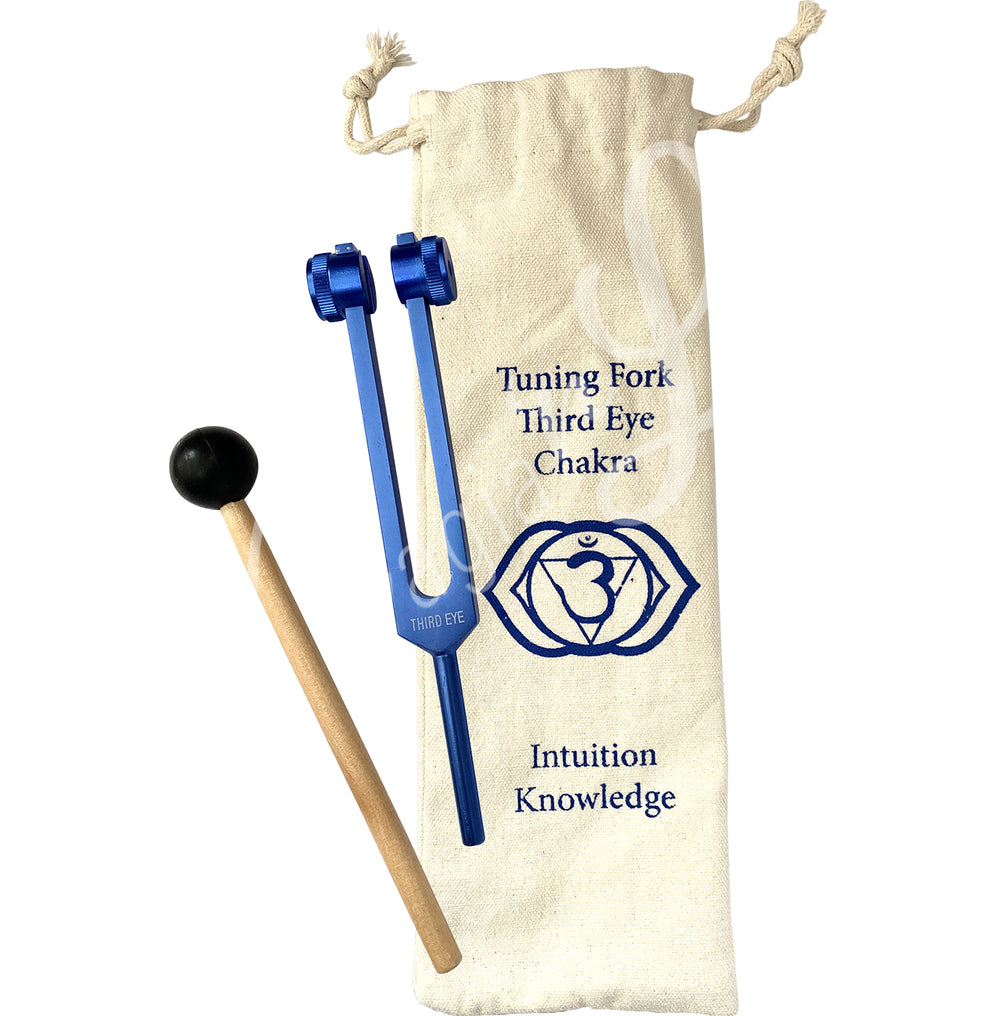 A Third Eye Chakra tuning fork set. The set includes:
Blue tuning fork labeled "THIRD EYE."
Wooden mallet with a black rubber head for striking the tuning fork.
Drawstring pouch with the following printed on it:
"Tuning Fork Third Eye Chakra"
A symbol representing the Third Eye Chakra.
Words "Intuition" and "Knowledge."
