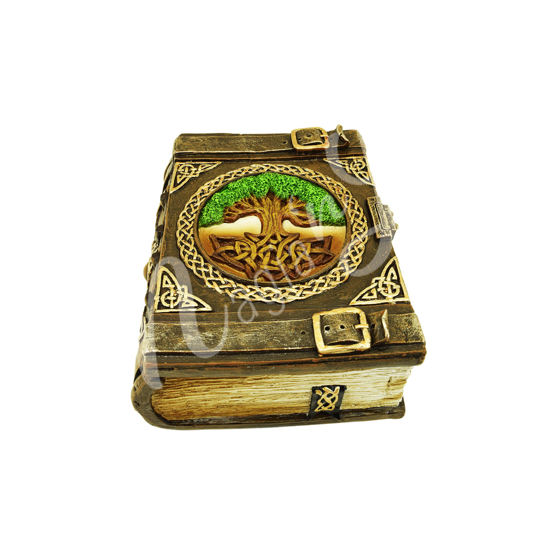A book box made of resin, adorned with a tree of life design.