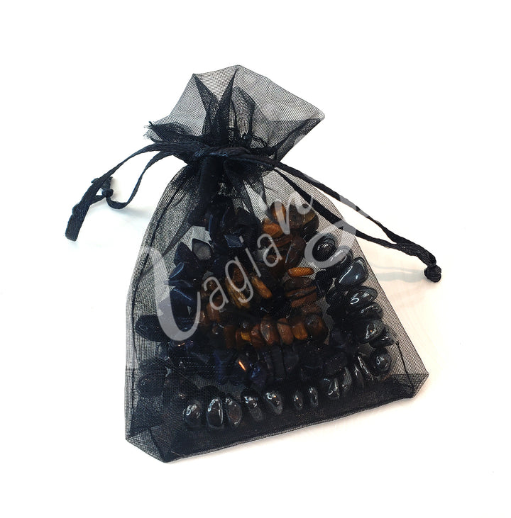 A close black organza bag with bracelets inside.