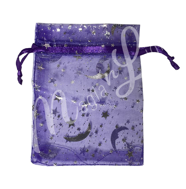 A purple organza bag, featuring a printed celestial design.